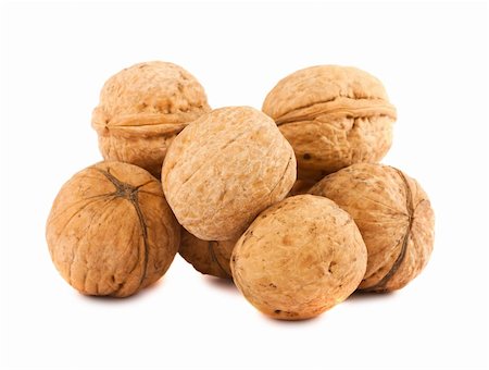simsearch:400-04415203,k - Heap of ripe walnuts isolated on white background Fotografie stock - Microstock e Abbonamento, Codice: 400-05710655
