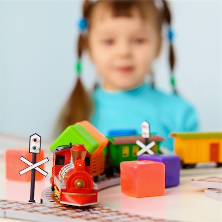 simsearch:400-05292821,k - Little girl plays with a toy railroad Stock Photo - Budget Royalty-Free & Subscription, Code: 400-05710900