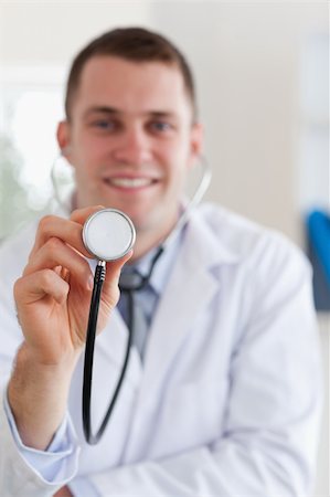 simsearch:400-05710928,k - Smiling doctor ready to use his stethoscope Stockbilder - Microstock & Abonnement, Bildnummer: 400-05710930