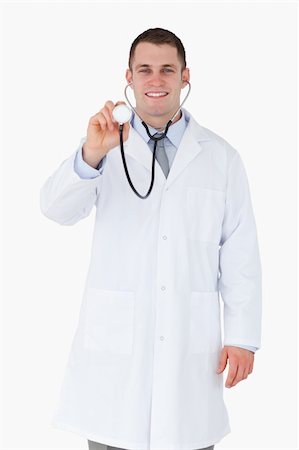 simsearch:400-05710928,k - Smiling doctor using his stethoscope on white background Stockbilder - Microstock & Abonnement, Bildnummer: 400-05710961