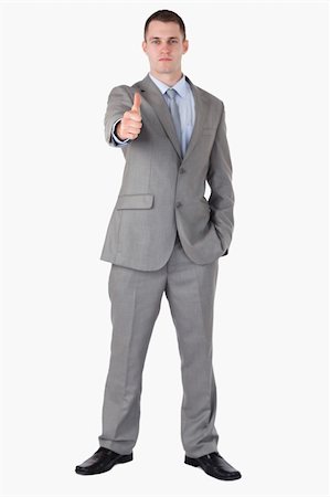 simsearch:400-05709450,k - Businessman giving thump up on white background Foto de stock - Super Valor sin royalties y Suscripción, Código: 400-05710986