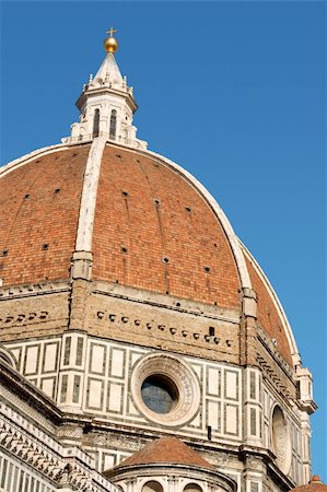 simsearch:400-05733973,k - Florence Cathedral of Santa Maria del Fiore or Duomo di Firenze, detail of Brunelleschi's dome against the blue sky. Stock Photo - Budget Royalty-Free & Subscription, Code: 400-05711100