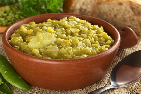 Split pea soup with potato in rustic bowl (Selective Focus, Focus one third into the bowl) Stock Photo - Budget Royalty-Free & Subscription, Code: 400-05711688