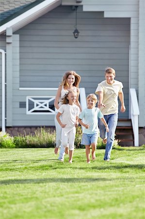 Running in the family garden Stock Photo - Budget Royalty-Free & Subscription, Code: 400-05711846