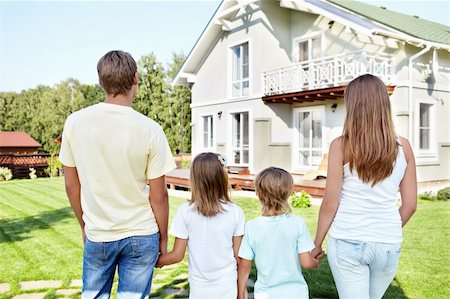 Family with children looking at the house Stock Photo - Budget Royalty-Free & Subscription, Code: 400-05711841