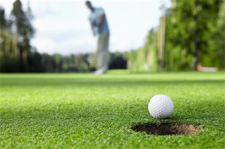 simsearch:400-05748592,k - Golfer drove the ball into the hole Stock Photo - Budget Royalty-Free & Subscription, Code: 400-05711899