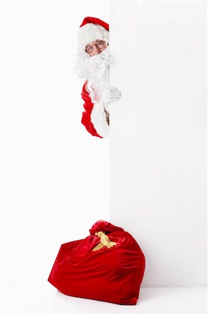 simsearch:400-06639922,k - Santa Claus with a bag of billboards and on a white background Stock Photo - Budget Royalty-Free & Subscription, Code: 400-05711926