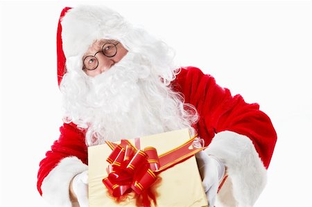 simsearch:400-06639922,k - Santa Claus with a gift isolated Stock Photo - Budget Royalty-Free & Subscription, Code: 400-05711948
