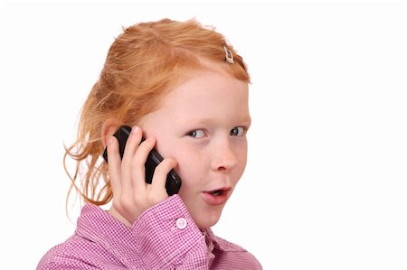 Happy young girl with cell phone on white background Stock Photo - Budget Royalty-Free & Subscription, Code: 400-05712140