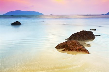 stones sand horizon - Sunrise over the sea. Stone on the foreground Stock Photo - Budget Royalty-Free & Subscription, Code: 400-05712717