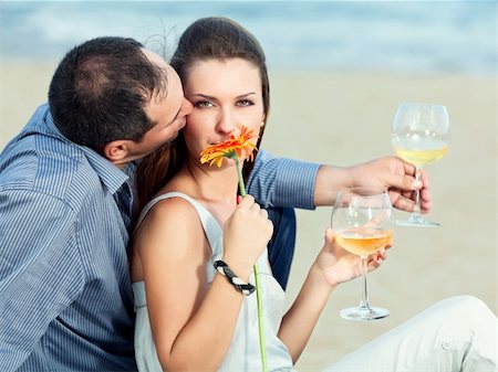 Young beautiful couple drinking wine on the beach Stock Photo - Budget Royalty-Free & Subscription, Code: 400-05712713