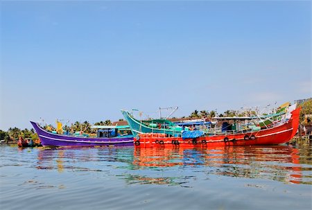 fishing boats in kerala - horizontal landscape of colorful fishing boats moored at Kochin backwaters Kerala India on the way to boat races held annually at North Paravoor Gothuruth, Kerala Stock Photo - Budget Royalty-Free & Subscription, Code: 400-05712966