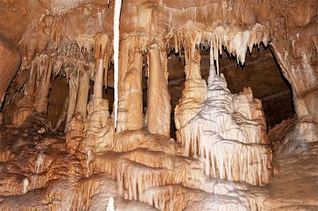 stalagmite - Javorice caves are located in central Moravia, about 10 miles west of Litovel city. Underground cave system Javorice a complex of corridors, domes and divides. Cave excel beautiful stalactite formations.  Javorice, Moravia, Czech republic. Stock Photo - Budget Royalty-Free & Subscription, Code: 400-05713575