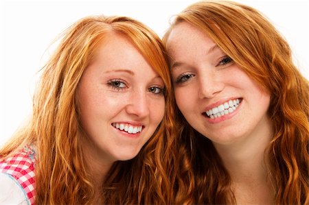 two happy bavarian redhead girls on white background Stock Photo - Budget Royalty-Free & Subscription, Code: 400-05713715