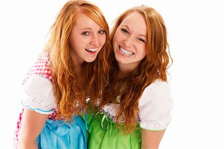 two happy bavarian redhead women on white background Stock Photo - Budget Royalty-Free & Subscription, Code: 400-05713718