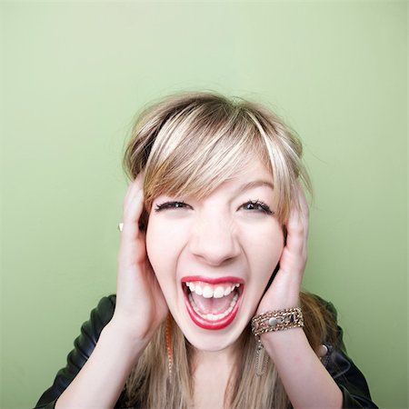 screaming woman vintage - Young Caucasian woman screams with ears covered Stock Photo - Budget Royalty-Free & Subscription, Code: 400-05713939