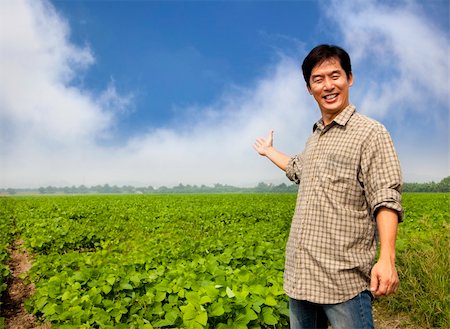 happy asian farmer showing his farm Stock Photo - Budget Royalty-Free & Subscription, Code: 400-05724255