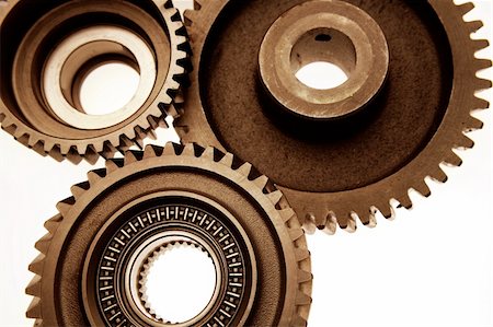 Closeup of three steel cogs Stock Photo - Budget Royalty-Free & Subscription, Code: 400-05725237