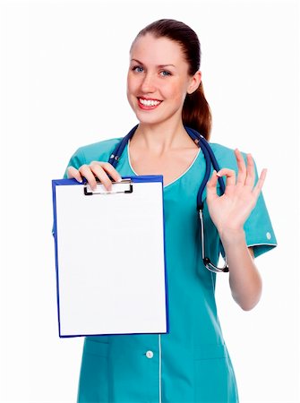 simsearch:400-04178933,k - Smiling female doctor holding a clipboard against white background. Stock Photo - Budget Royalty-Free & Subscription, Code: 400-05725778