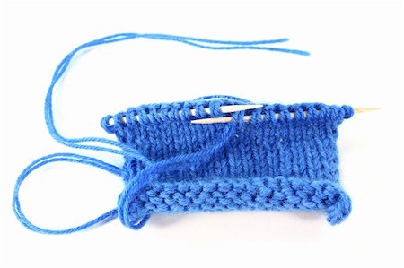 silencefoto (artist) - a blue knitted sample on a white background Stockbilder - Microstock & Abonnement, Bildnummer: 400-05725898
