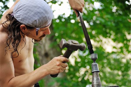 sledgehammer - Young blacksmith hammering hot iron on anvil Stock Photo - Budget Royalty-Free & Subscription, Code: 400-05726034
