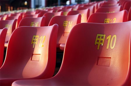 Row of plastic chairs in an open theater Stock Photo - Budget Royalty-Free & Subscription, Code: 400-05728002