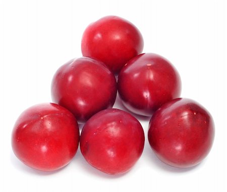 a pile of plums on a white background Stock Photo - Budget Royalty-Free & Subscription, Code: 400-05728065
