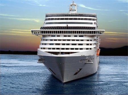 ship on waves - Luxury cruise ship sailing from port on sunset. Stock Photo - Budget Royalty-Free & Subscription, Code: 400-05728131