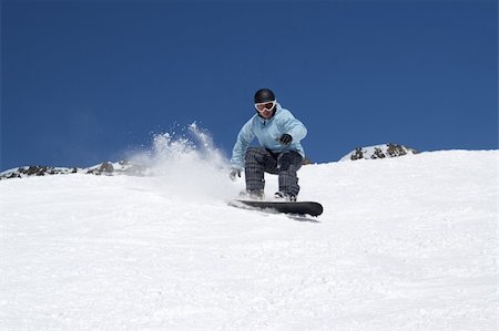 simsearch:400-04117720,k - Snowboarding in snowy mountains Photographie de stock - Aubaine LD & Abonnement, Code: 400-05728373