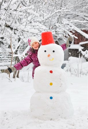 funny freezing cold photos - snowman and  girl Stock Photo - Budget Royalty-Free & Subscription, Code: 400-05728812