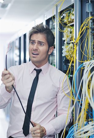 it business man in network server room have problems and looking for  disaster situation  solution Stock Photo - Budget Royalty-Free & Subscription, Code: 400-05728830