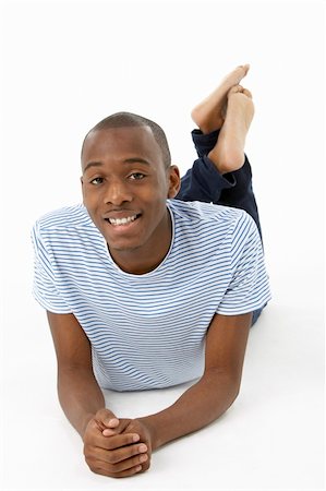 simsearch:400-05728957,k - Teenage Boy Laying On Stomach Stockbilder - Microstock & Abonnement, Bildnummer: 400-05728904