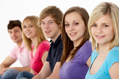 simsearch:400-05729065,k - Group Of Teenage Friends In Studio Fotografie stock - Microstock e Abbonamento, Codice: 400-05729057