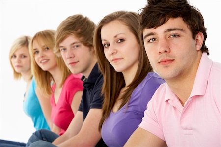 simsearch:400-05729065,k - Group Of Teenage Friends In Studio Fotografie stock - Microstock e Abbonamento, Codice: 400-05729058