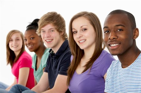 simsearch:400-05729065,k - Group Of Teenage Friends In Studio Fotografie stock - Microstock e Abbonamento, Codice: 400-05729059