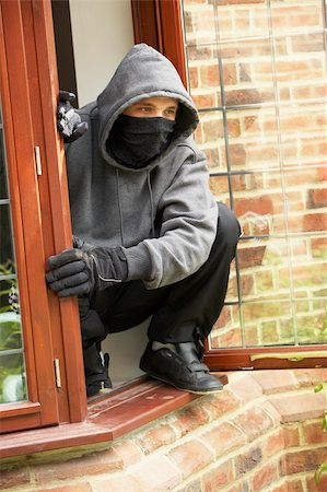 Young Man Breaking Into House Stock Photo - Budget Royalty-Free & Subscription, Code: 400-05729543