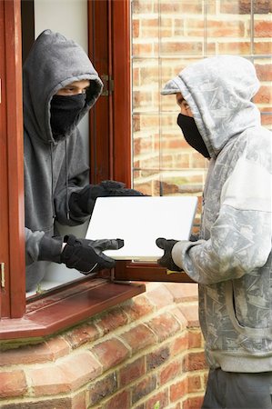 Young Men Breaking Into House Foto de stock - Royalty-Free Super Valor e Assinatura, Número: 400-05729576