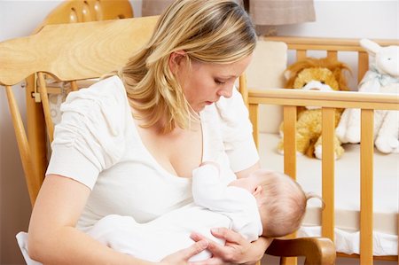 simsearch:400-05697417,k - Mother Breastfeeding Baby In Nursery Stock Photo - Budget Royalty-Free & Subscription, Code: 400-05729586