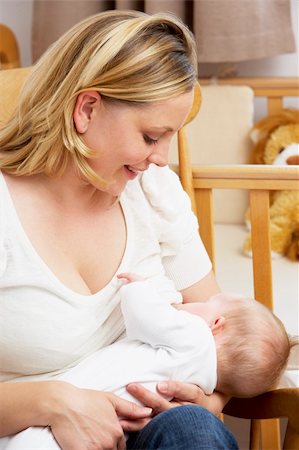simsearch:400-05697417,k - Mother Breastfeeding Baby In Nursery Stock Photo - Budget Royalty-Free & Subscription, Code: 400-05729587