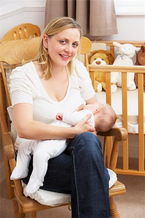 simsearch:400-05697417,k - Mother Breastfeeding Baby In Nursery Stock Photo - Budget Royalty-Free & Subscription, Code: 400-05729588