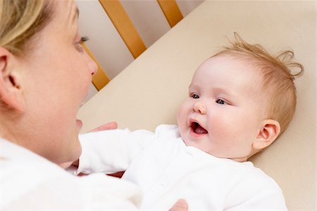 Mother Playing With Baby In Cot Stock Photo - Budget Royalty-Free & Subscription, Code: 400-05729600