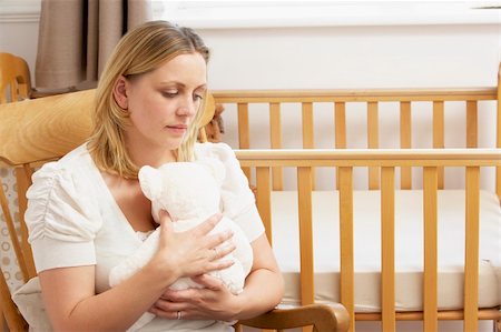 Sad Mother Sitting In Empty Nursery Stock Photo - Budget Royalty-Free & Subscription, Code: 400-05729602