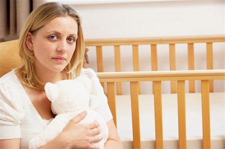 Sad Mother Sitting In Empty Nursery Stock Photo - Budget Royalty-Free & Subscription, Code: 400-05729603