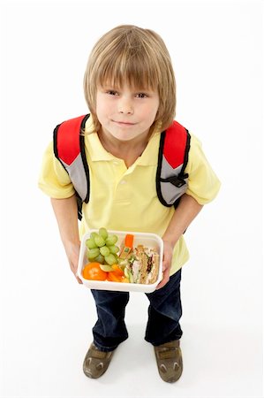 Studio Portrait of Smiling Boy Holding Lunchbox Stock Photo - Budget Royalty-Free & Subscription, Code: 400-05729700