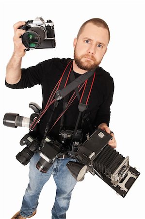 Portrait of photographer with multiple cameras of different styles. Stock Photo - Budget Royalty-Free & Subscription, Code: 400-05729721