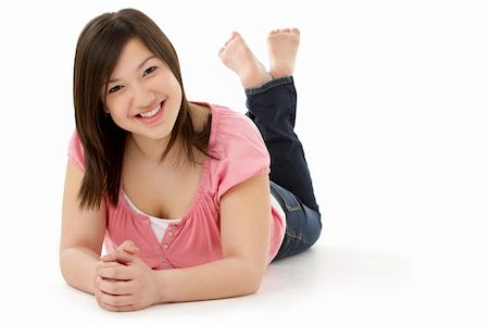 Teenage Girl Laying on Stomach Stock Photo - Budget Royalty-Free & Subscription, Code: 400-05729828