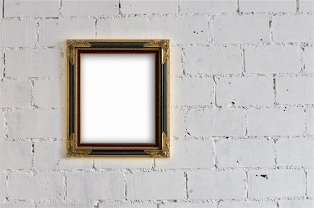 Old Wood and Gold Picture frame Hanging on White block wall Stock Photo - Budget Royalty-Free & Subscription, Code: 400-05720319