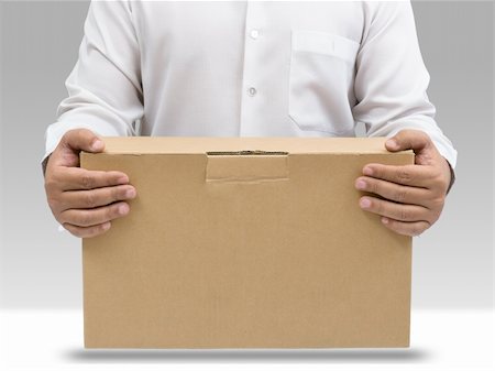 Businessman in white shirt carry brown paper box Fotografie stock - Microstock e Abbonamento, Codice: 400-05720339