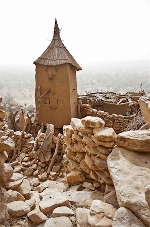 dogon rocks - Granaries in a Dogon village, Mali (Africa).  The Dogon are best known for their mythology, their mask dances, wooden sculpture and their architecture. Foto de stock - Super Valor sin royalties y Suscripción, Código: 400-05721341