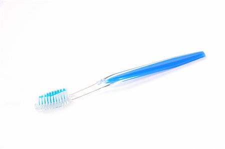 A plastic transparent blue toothbrush on a white background Stock Photo - Budget Royalty-Free & Subscription, Code: 400-05721471